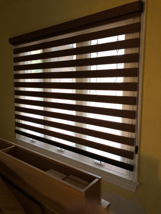Brown zebra shade on a wide window