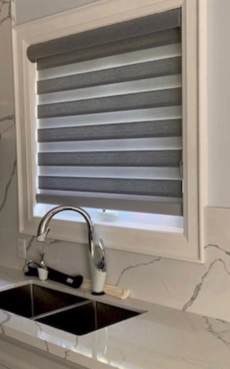 Grey zebra shade on a kitchen window